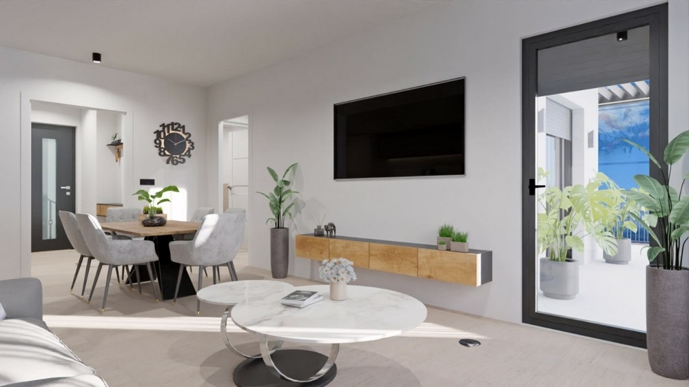 Nowoczesny salon z jadalnią, telewizorem i wyjściem na balkon z widokiem na morze.