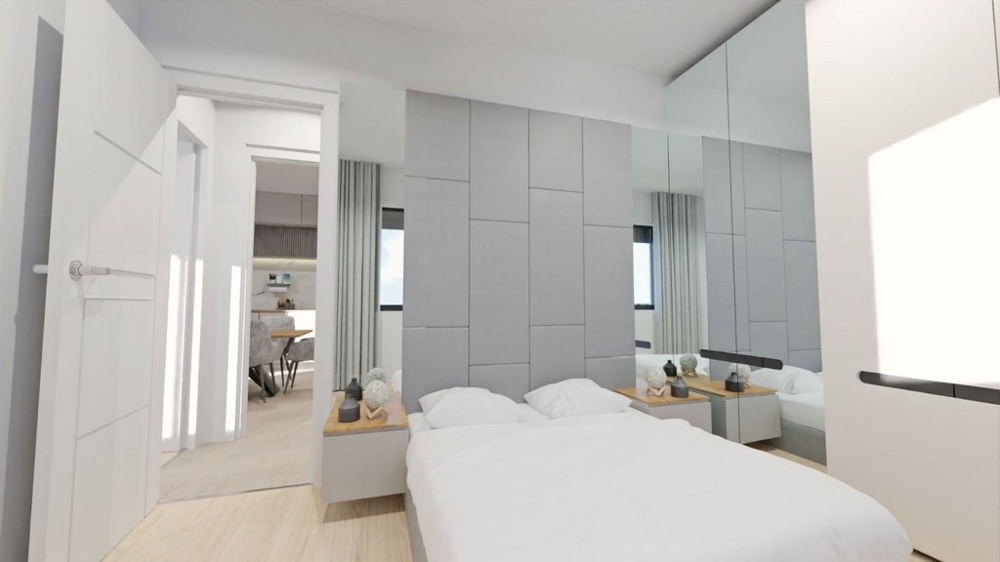 Jasna sypialnia z lustrami, białymi meblami i dostępem do salonów.