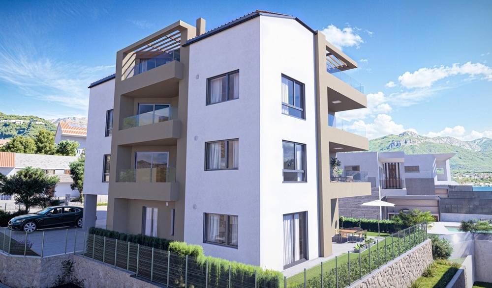 Widok na balkon z widokiem na morze i widokiem na sąsiednie białe domy z czerwonymi dachami. Panorama harcerska, zakup mieszkania w Chorwacji