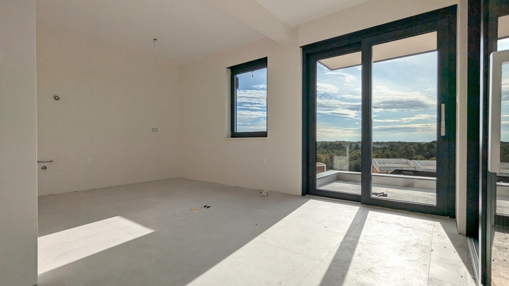 Pokój dzienny z wyjściem na taras w apartamencie A3536 na Istrii.