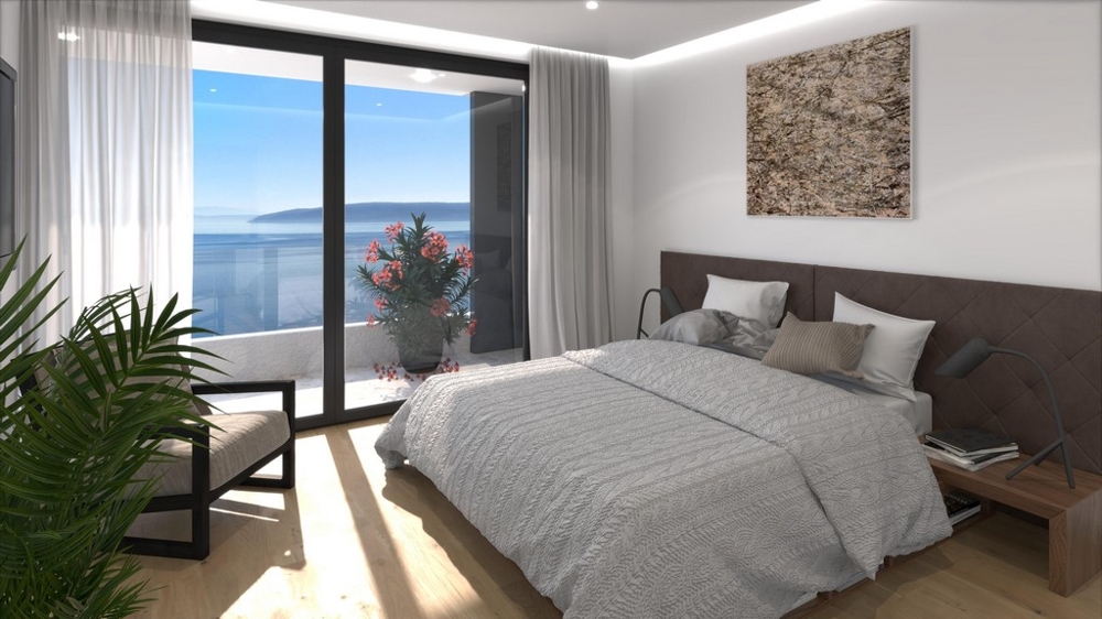 Sypialnia z dużym oknem i widokiem na morze