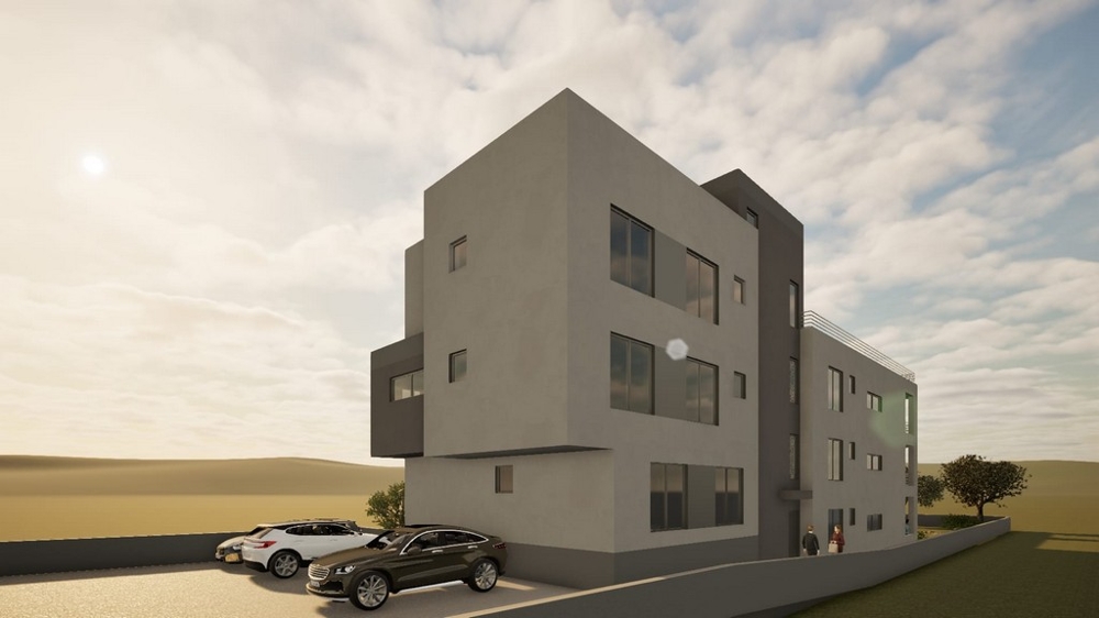 Nowy budynek mieszkalny z miejscami parkingowymi przed budynkiem