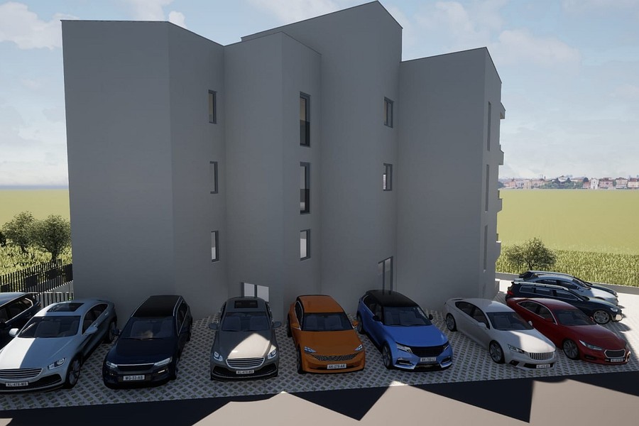 Tył budynku z miejscami parkingowymi na zewnątrz