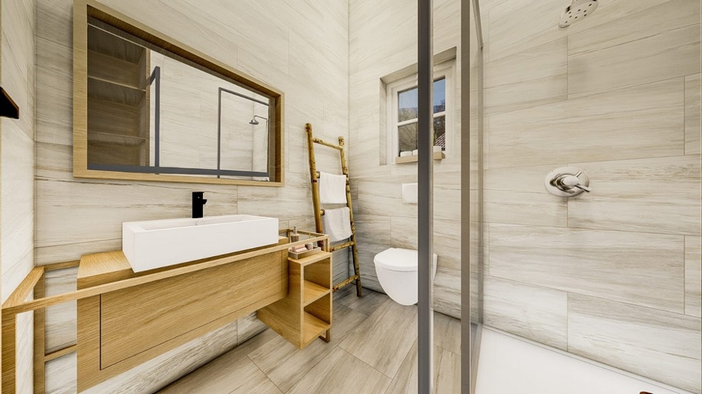 Nowoczesna łazienka z meblami z jasnego drewna, dużym lustrem, szklaną kabiną prysznicową i białymi urządzeniami sanitarnymi.