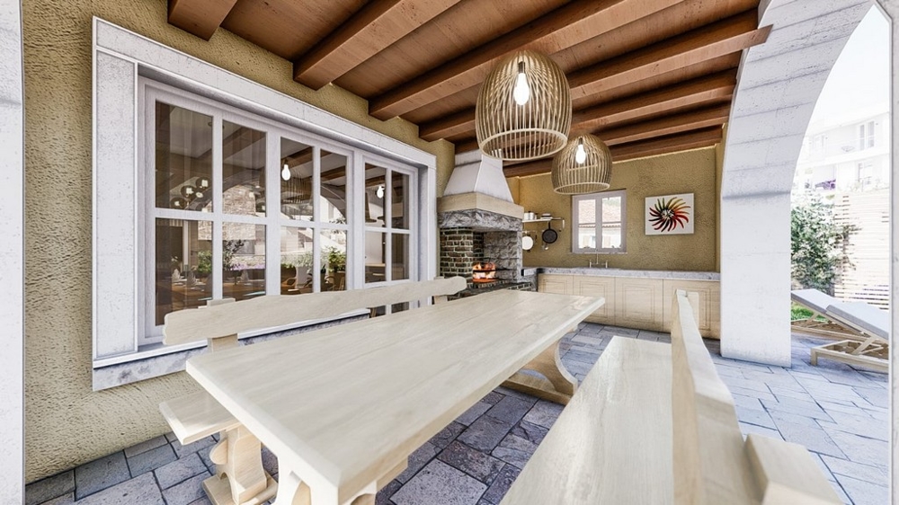 Zadaszony taras zewnętrzny ze stołem jadalnym w śródziemnomorskiej willi na wyspie Krk