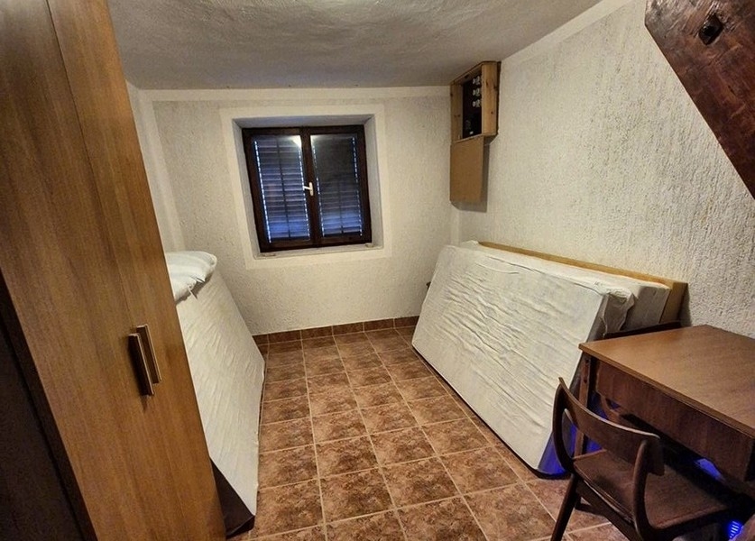 Sypialnia nieruchomości H3401 w Chorwacji.