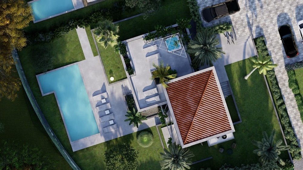 Widok z lotu ptaka na willę z basenem i ogrodem