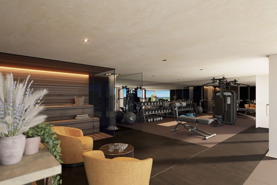 Sala fitness z nowoczesnym sprzętem i sauną