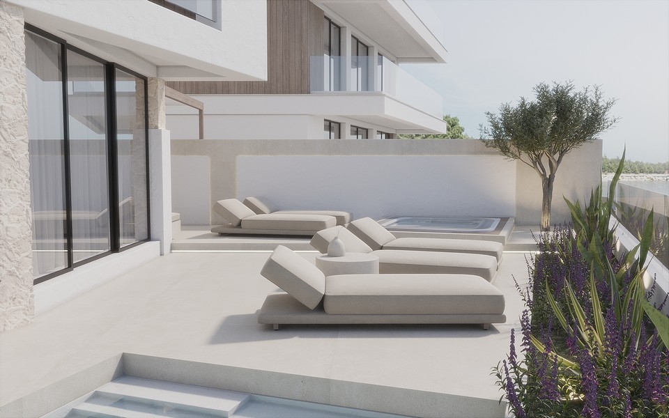 Taras z nowoczesnymi leżakami.