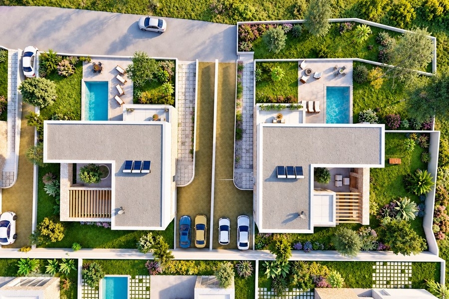 Widok z góry na wille kompleksu z miejscami parkingowymi